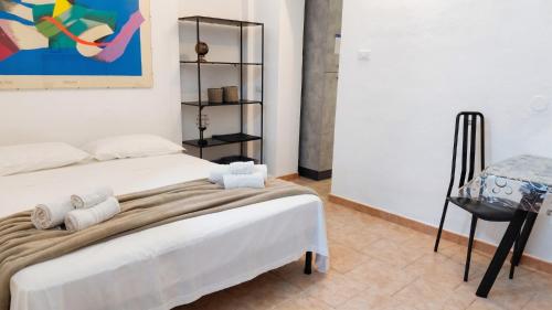 a bedroom with two beds with towels on them at Casa Olmedina in Olmedo