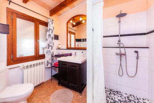 a bathroom with a toilet sink and a shower at Apartment Tina Capdepera in Capdepera