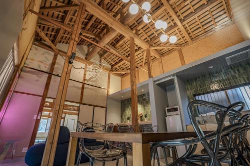 a dining room with a table and chairs at MITAMA House 01 ミタマ ハウス 01 in Ise
