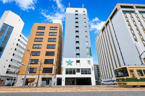 a building with a star on it in a city at Urbain Hiroshima Central in Hiroshima