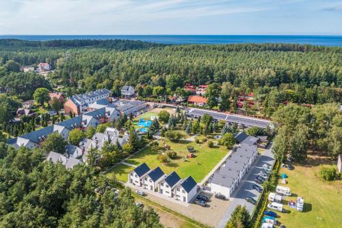 an aerial view of a resort with a park at Domy Morskie Dog Friendly in Jantar