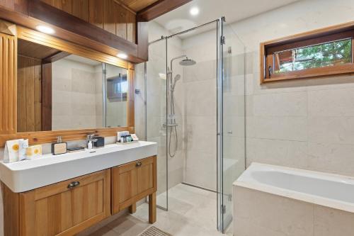 a bathroom with a sink and a shower at Pirin Golf Villa in Bansko