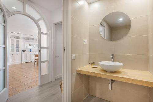 a bathroom with a sink and a mirror at Mora Beach in Tarragona