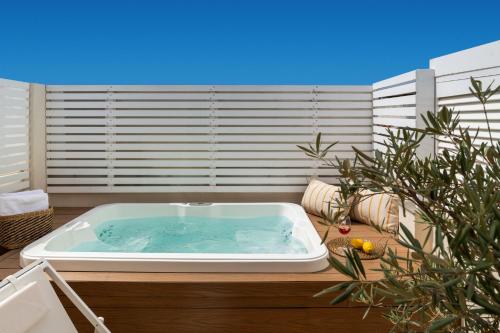 a jacuzzi tub sitting on top of a patio at Alameda 1851 - Private jacuzzi in Seville