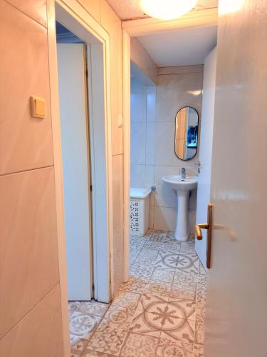 a bathroom with a toilet and a sink at Premier Sea Apartment in Paleo Tsifliki