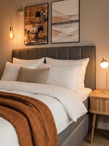 a bedroom with a large bed with white pillows at Limehome Berlin Müllerstraße - Digital Access in Berlin