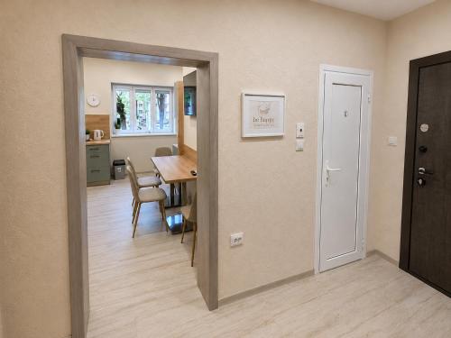 a room with a table and a dining room at Apartment Be Happy 3, Premium Apartment in Ruse City Centre in Ruse