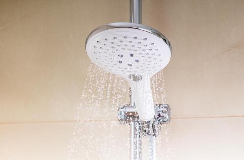 a shower head with water coming out of it at NH Brussels EU Berlaymont in Brussels