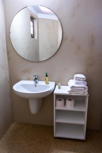 a bathroom with a sink and a mirror at Porto Franco Sulina in Sulina