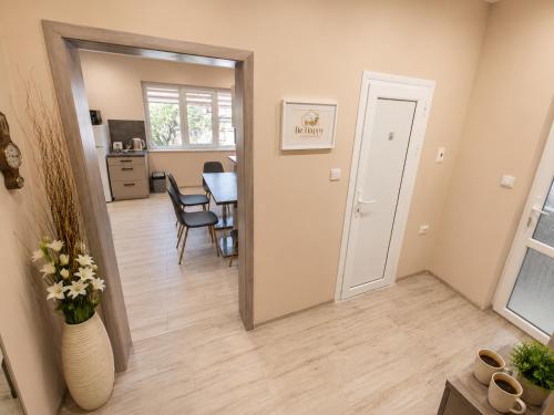 a room with a hallway with a table and a mirror at Apartment Be Happy 6, Premium Apartment in Ruse City Centre in Ruse