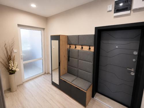 a room with a black closet with a door at Apartment Be Happy 6, Premium Apartment in Ruse City Centre in Ruse