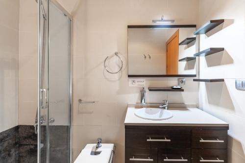 a bathroom with a toilet and a sink and a shower at Be Free Arco Almeria in Almería