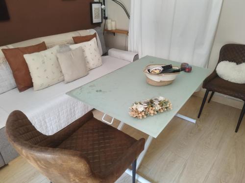 a living room with a table and a bed at CASA GORDON in Navaluenga