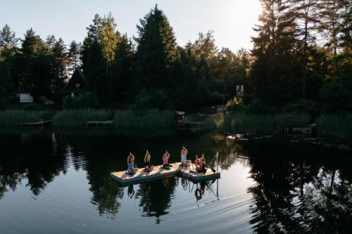 a group of people on a boat on a lake at Augustów Willa Sóweczka in Sucha Rzeczka