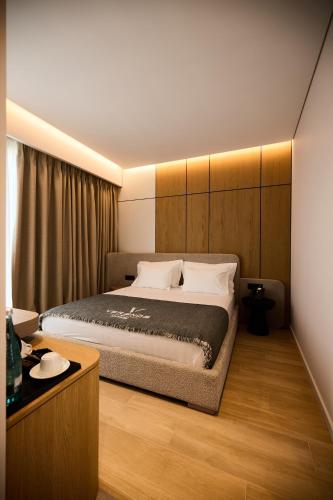 a bedroom with a large bed in a room at Veranda Hotel by Mirage in Ksamil
