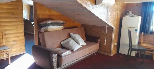 a living room with a couch in a house at Апартаменти Аліканте in Zatoka