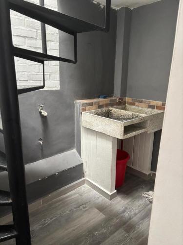 a bathroom with two sinks and a shower at San Joaquín B&B in Cali