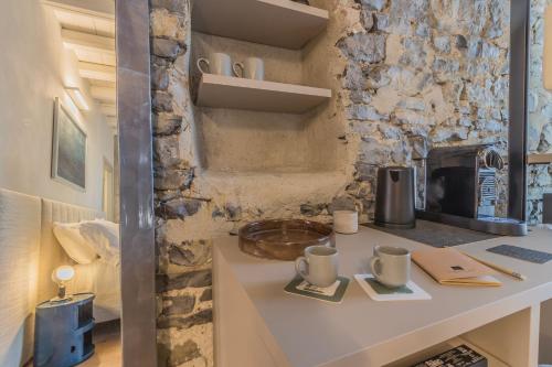 a kitchen with a counter with two mugs on it at La Corte Del Lario - Contrada Scoscesa in Varenna