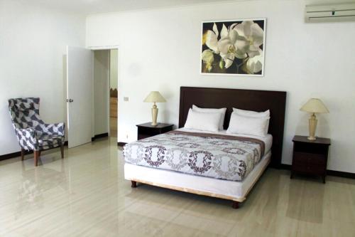 En eller flere senger på et rom på Siaga Raya Creative Villas