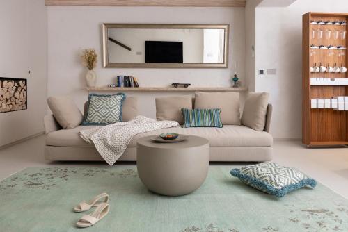 a living room with a couch and a table at Stone House Orsera II in Vrsar