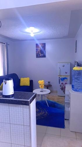 a living room with a couch and a table at Classic in Narok