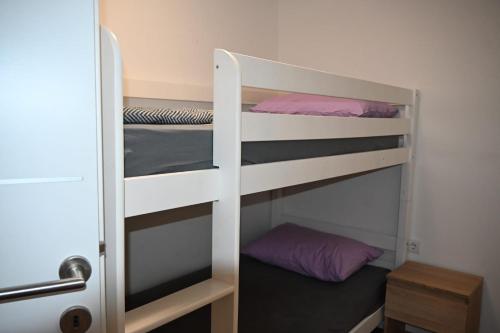 a room with two bunk beds in a room at Leona in Senj