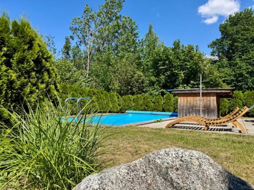 a swimming pool in the middle of a yard at Haus Dorothee in Sautens