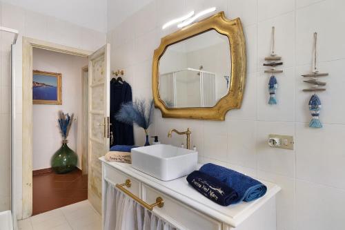 a bathroom with a sink and a mirror at Pietra nel mare in Pietra Ligure