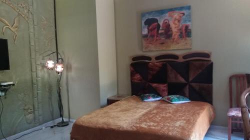 a bedroom with a bed with two pillows on it at Domskazka in Bruchim Qela' Alon