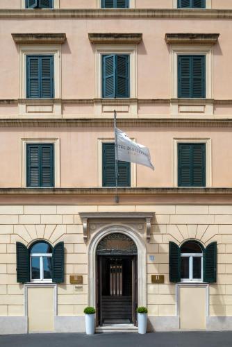 a building with a flag in front of it at Hotel Diocleziano in Rome