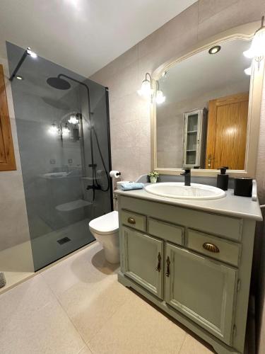 a bathroom with a sink and a shower at Es Cantonet in Calvià