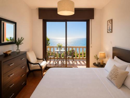 a bedroom with a bed and a view of the ocean at Holibai Vila Santa Rita Vistas al mar cerca de Baiona in Oia
