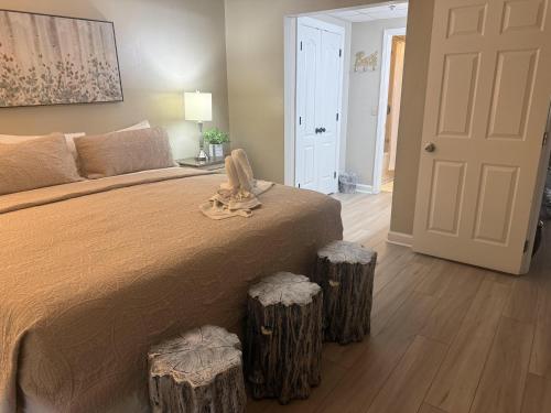 a bedroom with a large bed with two at River Place Condos #401 2BD in Pigeon Forge