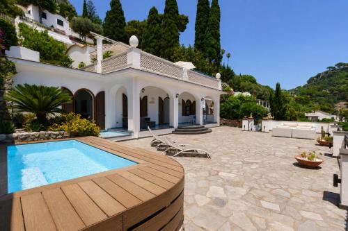 a villa with a swimming pool and a house at Villa La Baika by MyVillaCollection in Capri