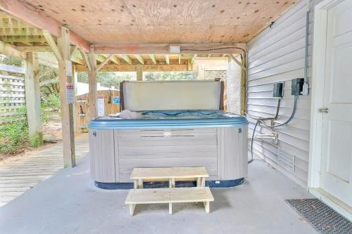 a hot tub sitting on the side of a building at 4125 - Sea Dawg in Kitty Hawk