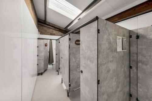 a row of lockers in a room with a ceiling at Farmer's Cabin in Forfar