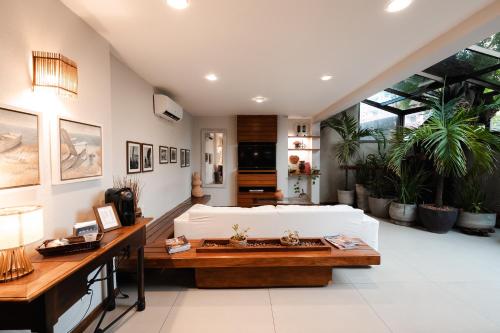 a living room with a white couch and a table at Carppa Hotel in Fortaleza