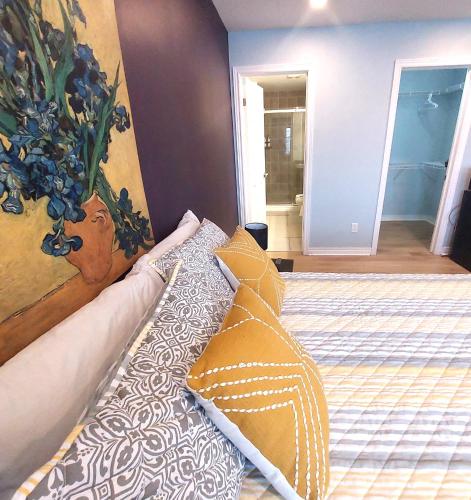 a bed with two pillows on it in a room at Nimo Homestay in Guelph
