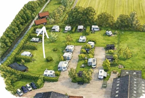 an aerial view of a parking lot with parked cars at glamping met landelijk uitzicht in Spanga