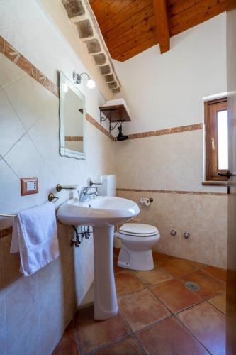 a bathroom with a sink and a toilet at Country House B&B Antica Dimora Del Sole in Camerota