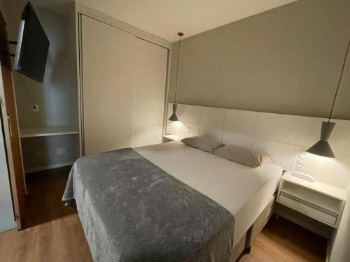 a bedroom with a large bed in a room at Ocean Flat 707 - Praia da Costa in Vila Velha