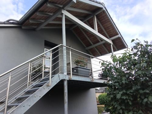 a balcony of a building with plants on it at Ferienwohnung Brönnleins in Koblenz