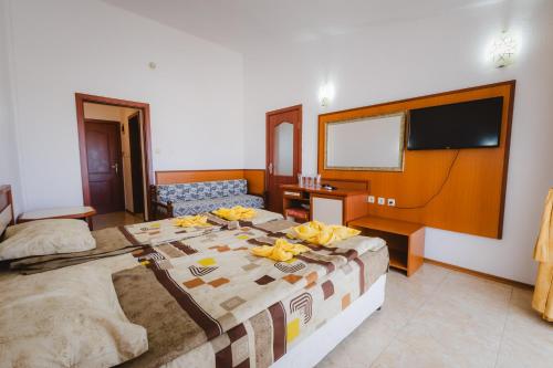 a bedroom with a bed with bananas on it at Stefanov 2 Hotel in Lozenets