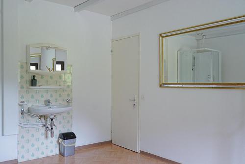 a bathroom with a sink and a mirror on the wall at Ristorante Locanda Zott in Valle Onsernone in Vergeletto