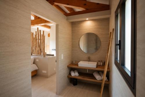 a bathroom with a sink and a mirror at Casamore in Meria