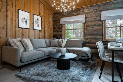 a living room with a couch and a table at Chalet Ruka Aurelius in Ruka