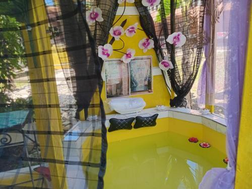 a toy room with a toilet and a window at Movement and Reposé in Clarks Town