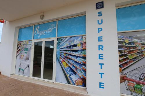 a store with a sign on the side of it at Lunja Village - Agadir in Taghazout