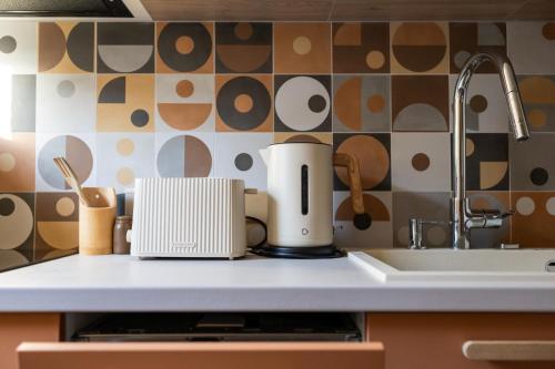a kitchen counter with a coffee maker and a sink at Horizon 180 in Varna City