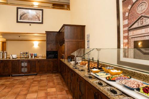 a kitchen with a buffet of food on a counter at The Inn at UCLA in Los Angeles